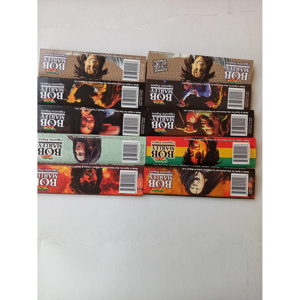 Premium imported Bob Marley King Rolling Paper packs, showcasing vibrant designs, available at Curat Cart for an exceptional rolling experience.