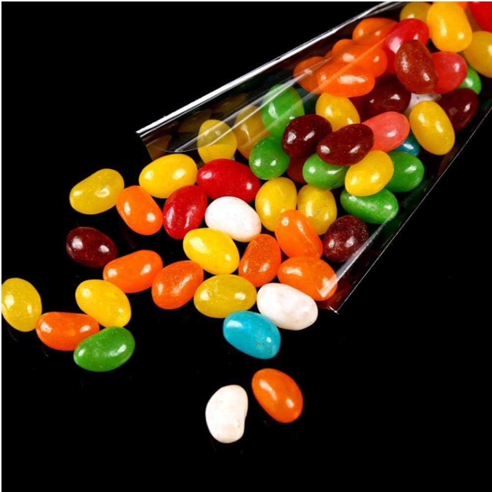 Vibrant jelly beans in assorted colors spilling from a transparent bag, perfect for party treats and celebrations.