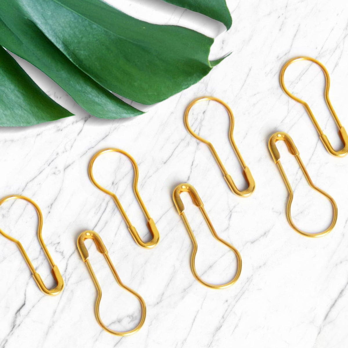 Gold safety pins for DIY craft, specially curated by Curat Cart, perfect for your creative projects. Enhance your crafting experience.