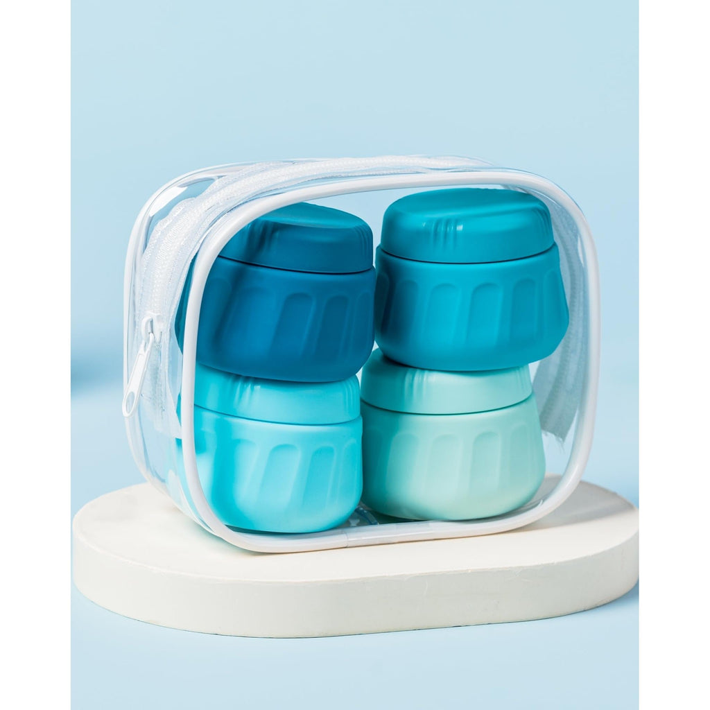 4-piece set of Mrsdry travel containers for toiletries, featuring vibrant blue and green colors in a clear zip pouch.