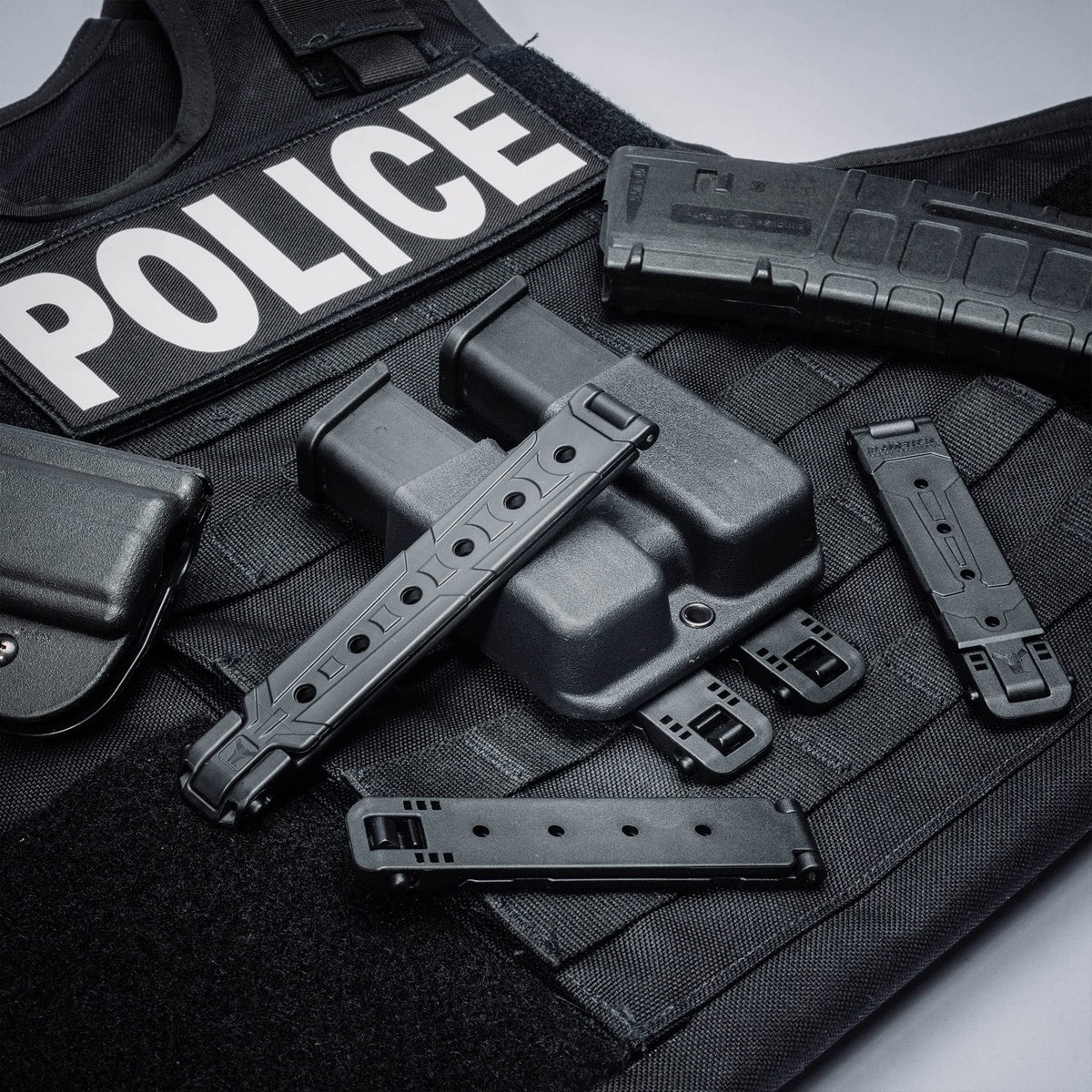 Molle-Lok Attachment Clip showcased on tactical gear, featuring high-quality finish in official packaging. Available at Curat Cart.