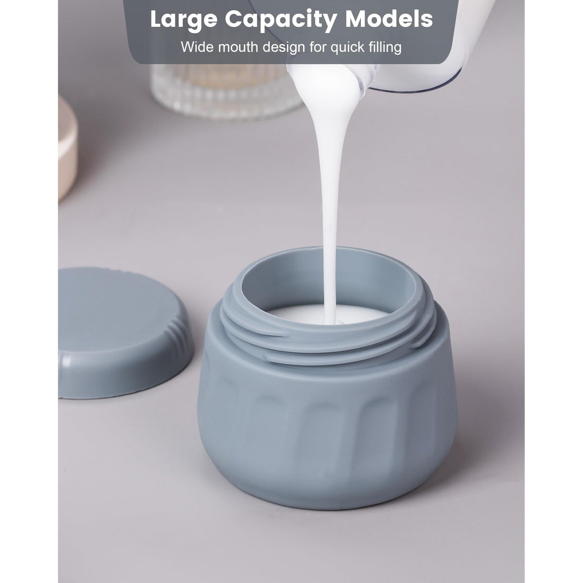Stylish gray travel container with a wide mouth, ideal for quick filling of toiletries, designed for convenience.