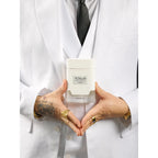 Premium imported Khadlaj Shiyaaka Snow fragrance featuring citrusy and woody notes, elegantly presented in a stylish white bottle.
