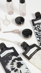 Buy now Kitsch 11 PCS Travel Bottles for Toiletries â€“ Travel Essentials Kit for Shampoo, Conditioner, Lotion & More - TSA Approved Travel Bottles, Leak-Proof Refillable Travel Size Containers - Black & Ivory at indiglob india