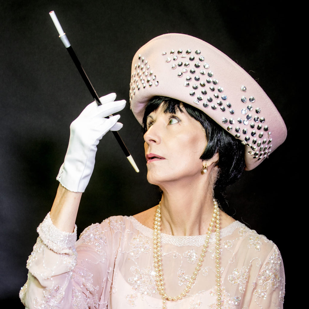 Elegant model with a 4E's Novelty Cigarette Holder, specially curated by Curat Cart for a classy touch. Perfect for distinct style.