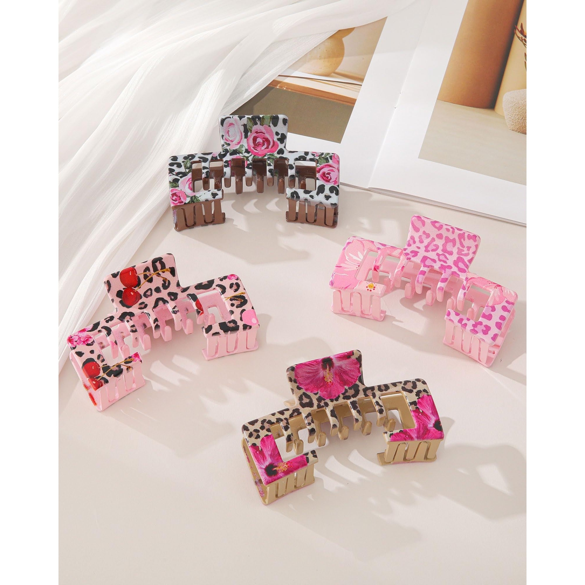 Set of vibrant claw clips with floral and animal prints, designed to complement baseball caps while securing hair.