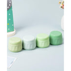 Authentic Mrsdry travel containers in soothing green colors, perfect for organizing toiletries on the go.