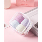 Set of four pastel travel containers in a clear pouch, perfect for toiletries. Verified by CuratCart for quality.