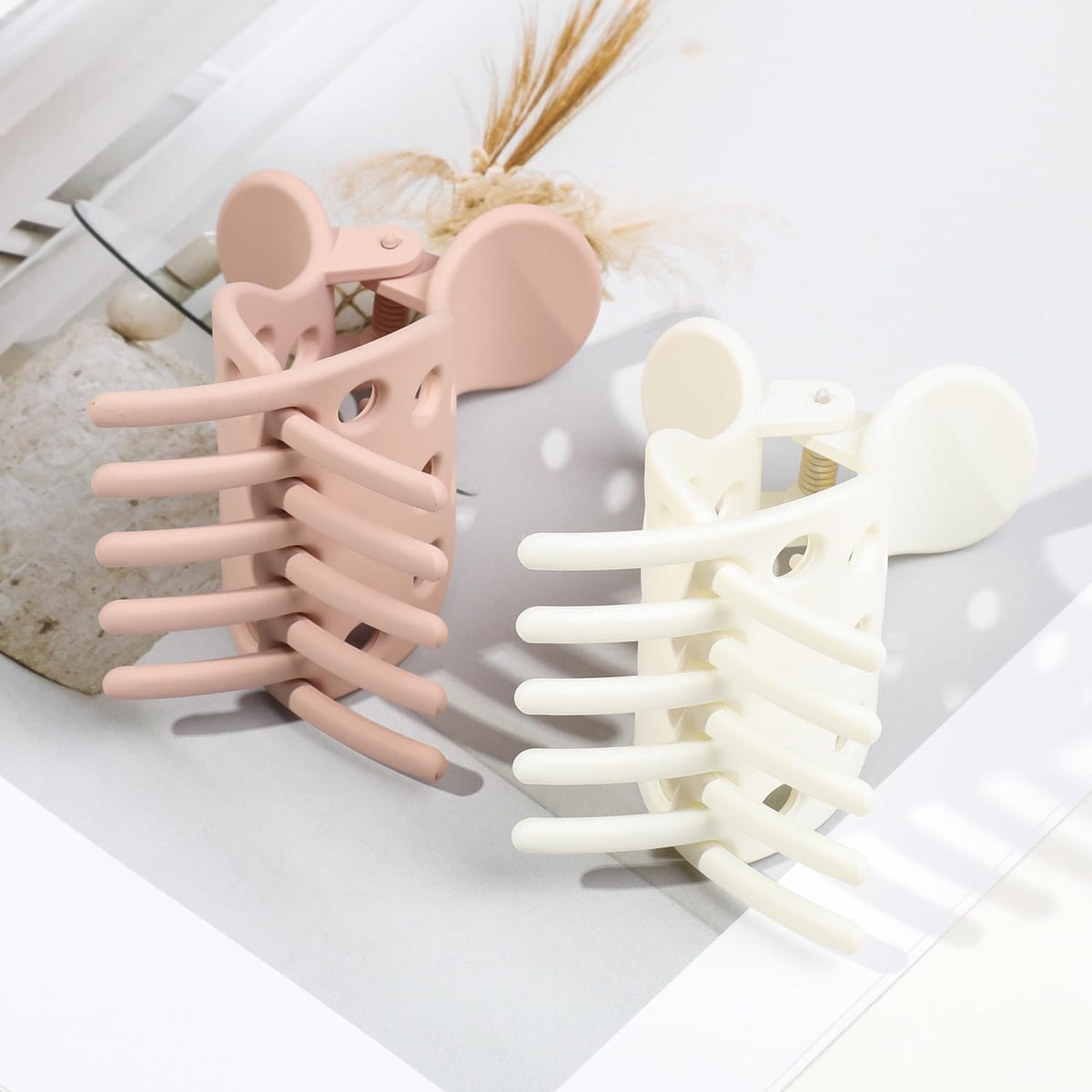 Set of 10 hair volume clips in pink and white shades, perfect for styling curls. Verified by CuratCart for quality.