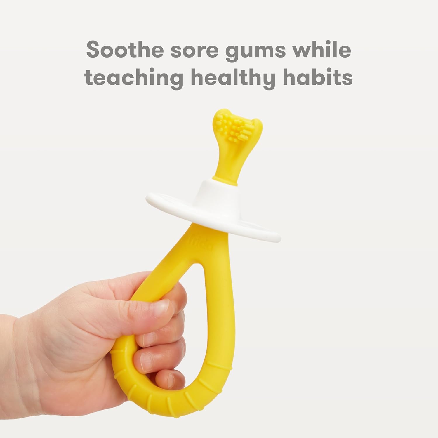 Buy now Frida Baby Training Toothbrush for Babies with Soft Silicone Bristles, Yellow at indiglob india
