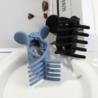 Set of premium imported hair volume clips in blue and black, perfect for enhancing curly hairstyles and adding lift.