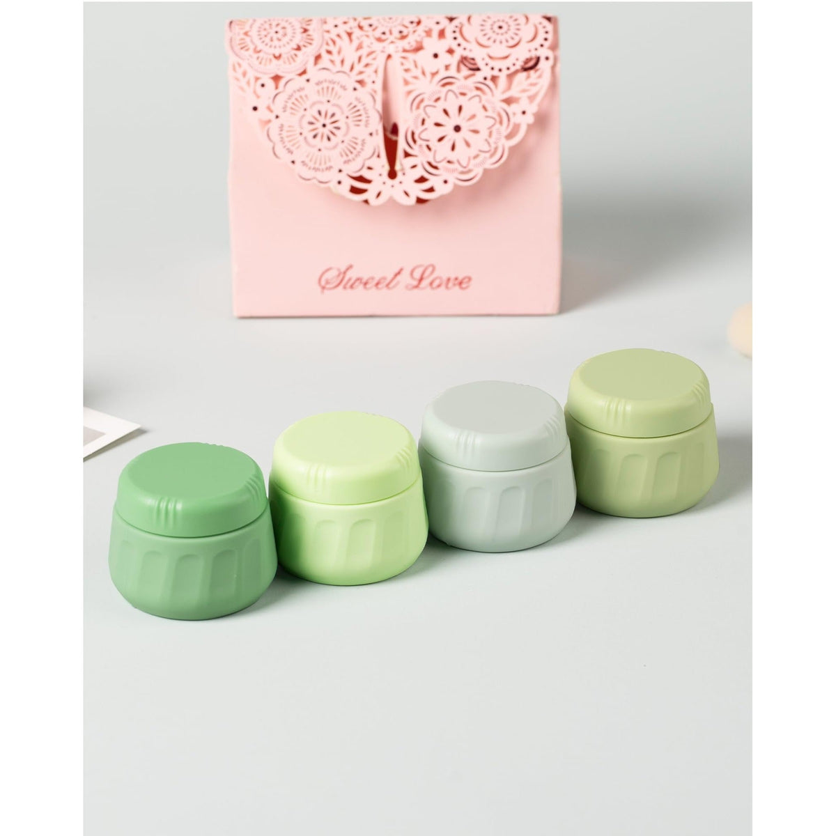 Set of four vibrant Mrsdry travel containers for toiletries. Available in India. Order online for easy organization.