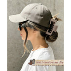 Premium imported hat-friendly claw clip securely holds hair, perfect for wearing with baseball caps.