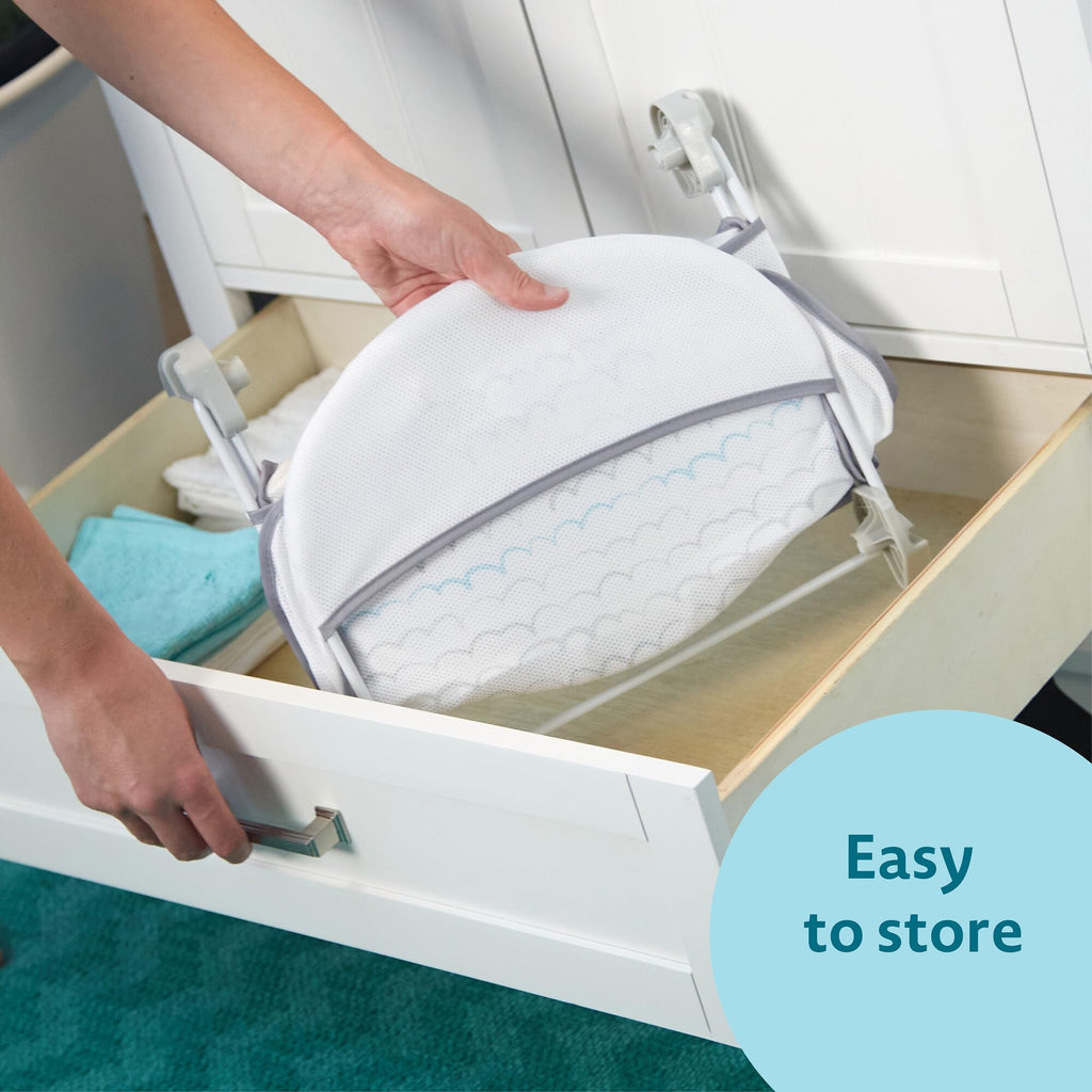The First Years Sure Comfort Folding Baby Bather - Foldable Baby Bath Seat and Lounger for Home or On the Go - for Sink or Tub Use - Non-Slip Seat - For Up to 15 Lbs