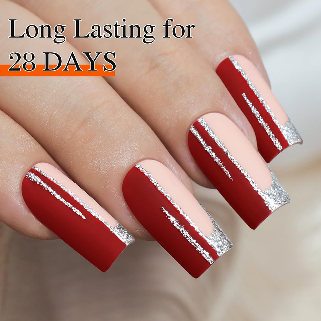 Vibrant red nails accented with metallic silver stripes; promises long-lasting wear for 28 days, showcasing a stylish manicure.