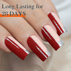 Vibrant red nails accented with metallic silver stripes; promises long-lasting wear for 28 days, showcasing a stylish manicure.
