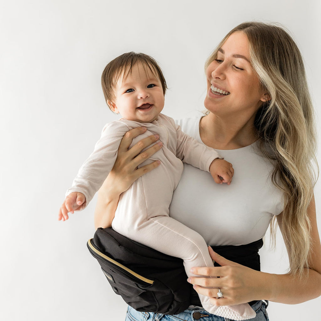 Buy now Tushbaby Original Hip Seat Baby Carrier for Babies & Toddlers up to 45 lbs, Safety Certified, Lightweight No-Foam Design with Storage & Nursing Support, Grey Black Gold at indiglob india