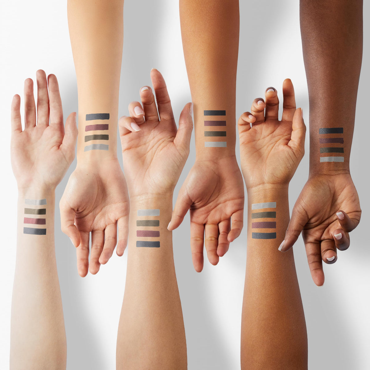 Showcasing Kaely 2Pcs Gel Eyeliner Pencil tones on diverse skin tones. Original product swatches on multiple arms.