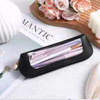 Stylish small clear makeup bag in black PU leather with visible makeup tools. Available for order online.