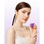 A young woman holds a genuine Mrsdry travel container for toiletries, showcasing its stylish and compact design.