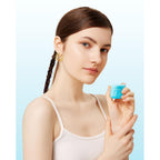 Model holding a blue Mrsdry travel container for toiletries. Verified by CuratCart for quality and trust.