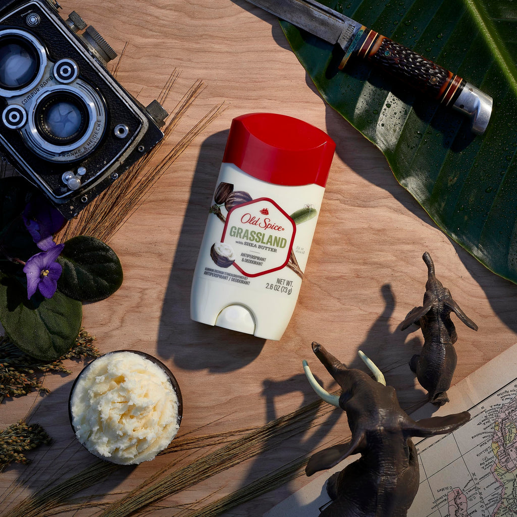 Old Spice Grassland Antiperspirant deodorant on a textured surface with nature elements, showcasing premium quality.
