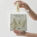 Clear pouch holding Abib products and a trial kit featuring PDRN Vegan Collagen Lip Mask, perfect for hydration and smoothing.