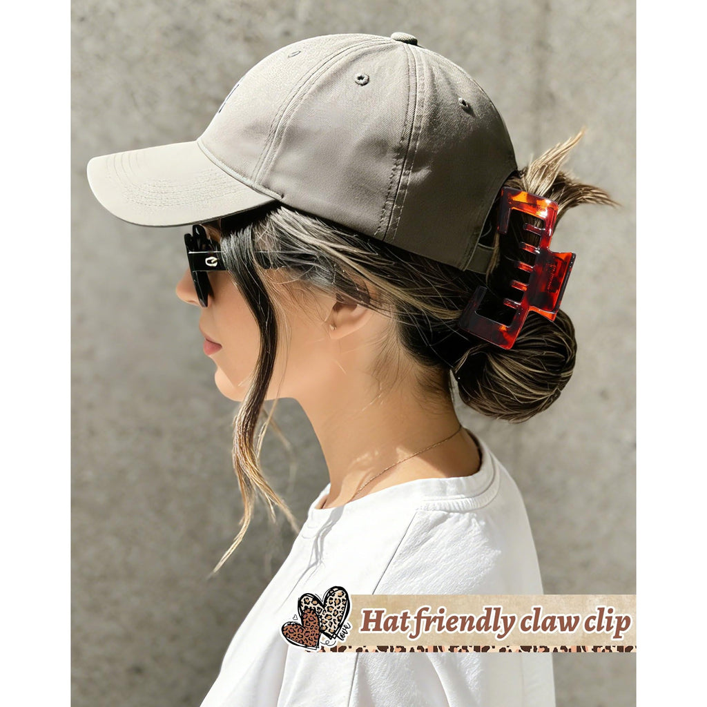 Premium imported hat-friendly claw clip securely holds hair while wearing a baseball cap for a stylish look.