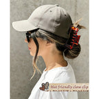 Premium imported hat-friendly claw clip securely holds hair while wearing a baseball cap for a stylish look.