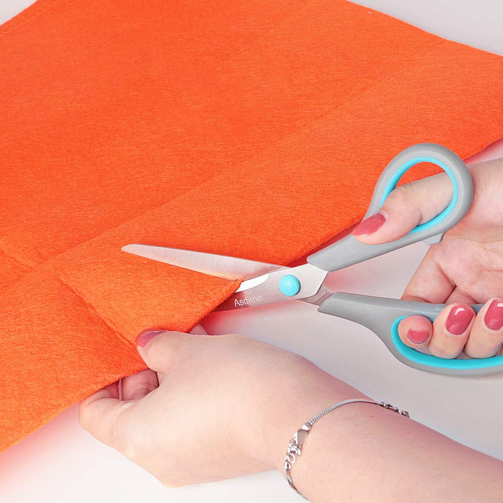 Discover the premium Asdirne Scissors Set, expertly cutting vibrant fabric. Elevate your crafting with Curat Cart's imported collection.