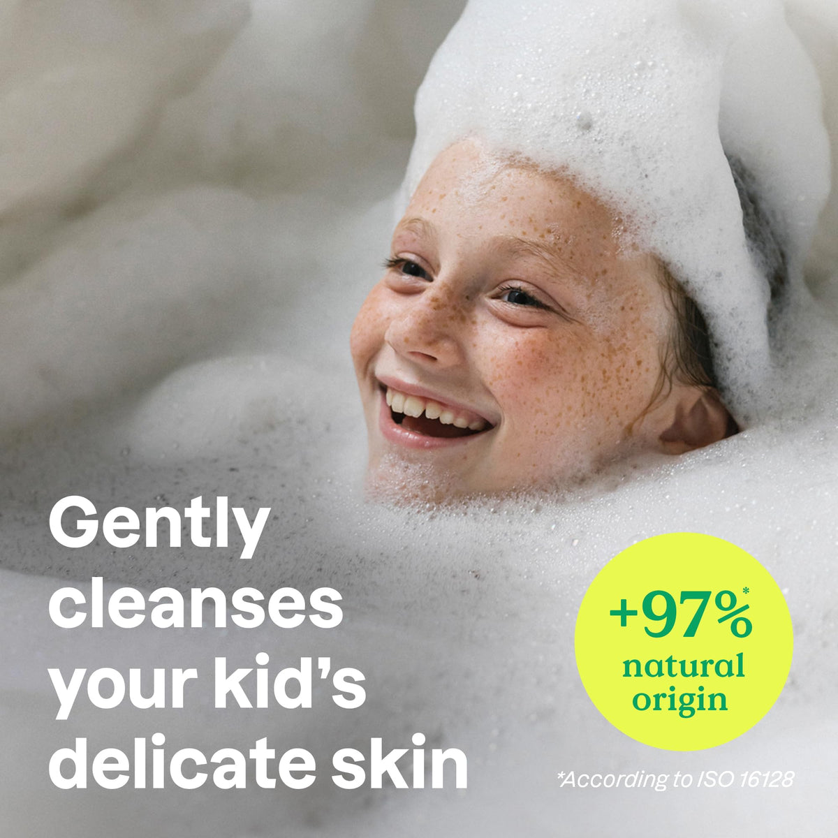 A joyful child covered in bubbles. Authentic Attitude Bubble Wash for Kids, 97% natural origin, gentle on delicate skin.