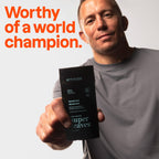 Attitude Men's Patchouli & Bourbon Deodorant in a champion's hand; 95% natural ingredients, Verified by CuratCart.
