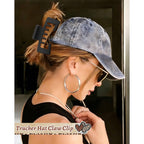 A woman wearing a baseball cap uses a claw clip to secure her hair. Verified by CuratCart for quality and style.