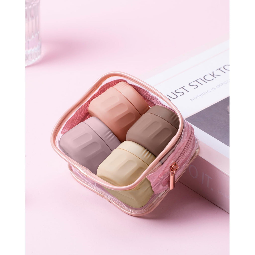 Mrsdry travel containers feature four stylish jars in pink and neutral shades, ideal for toiletries on-the-go.