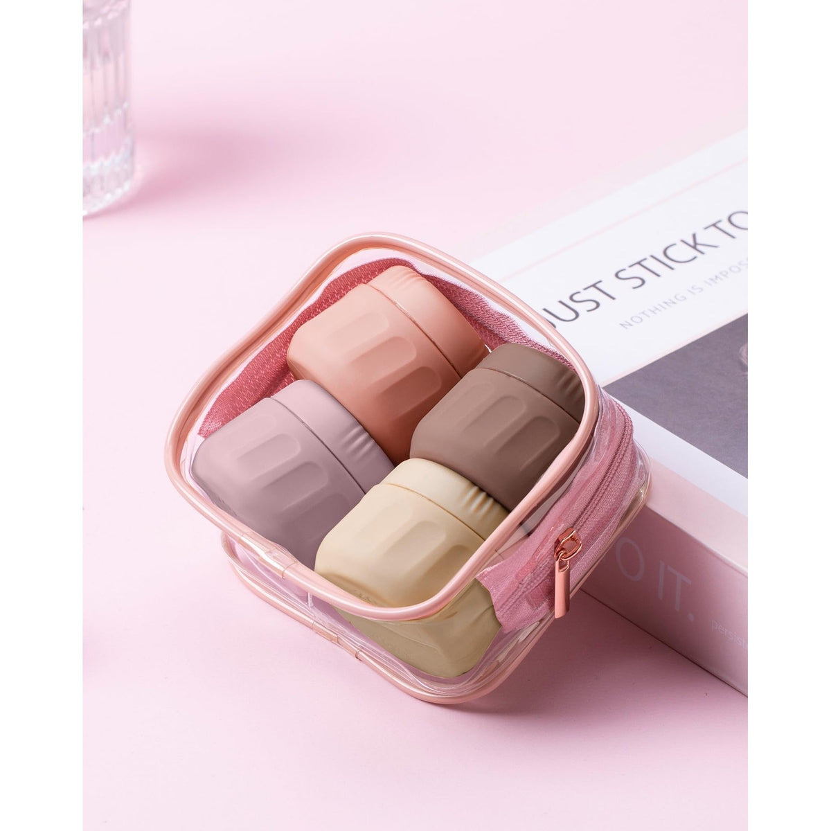 Mrsdry travel containers feature four stylish jars in pink and neutral shades, ideal for toiletries on-the-go.