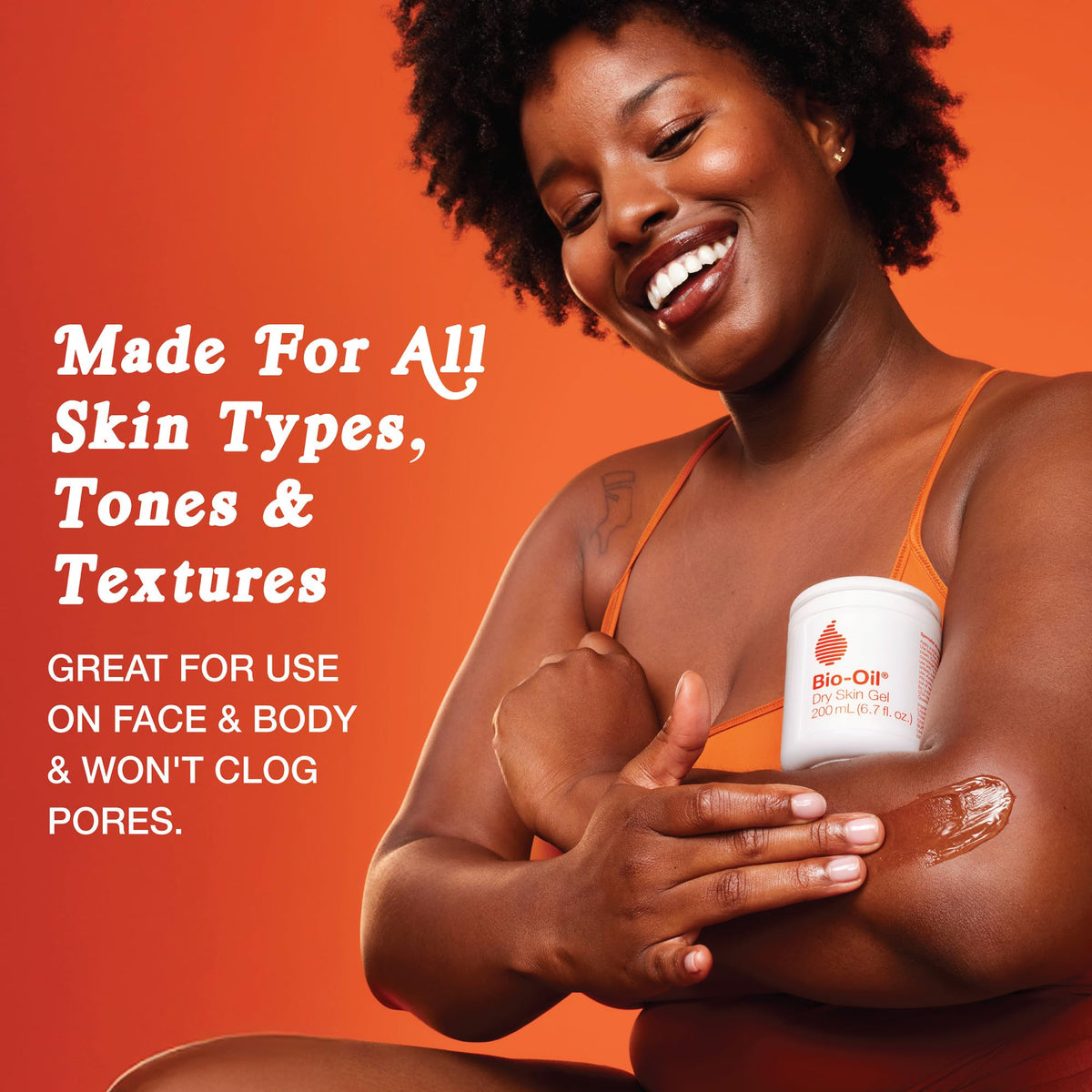 A smiling woman applying Bio-Oil Dry Skin Gel, promoting hydration for all skin types. 100% authentic product.