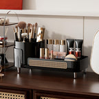 Stylish black rotating makeup organizer with compartments for brushes, lipsticks, and cosmetics, ideal for tidy storage.