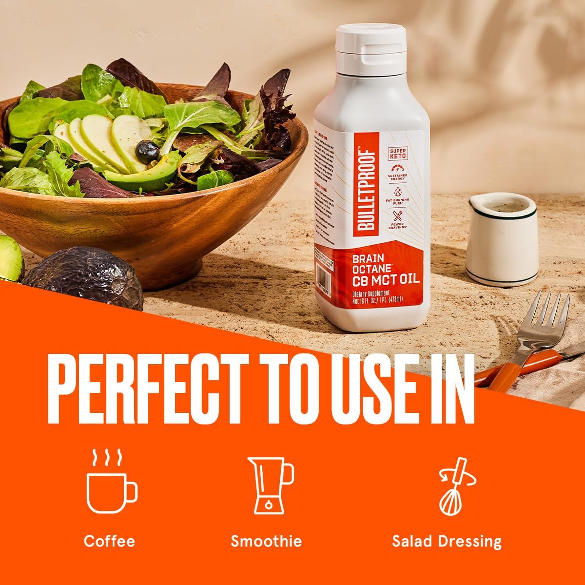 Bulletproof Brain Octane C8 MCT Oil displayed beside a vibrant salad bowl, ideal for coffee, smoothies, and dressings.