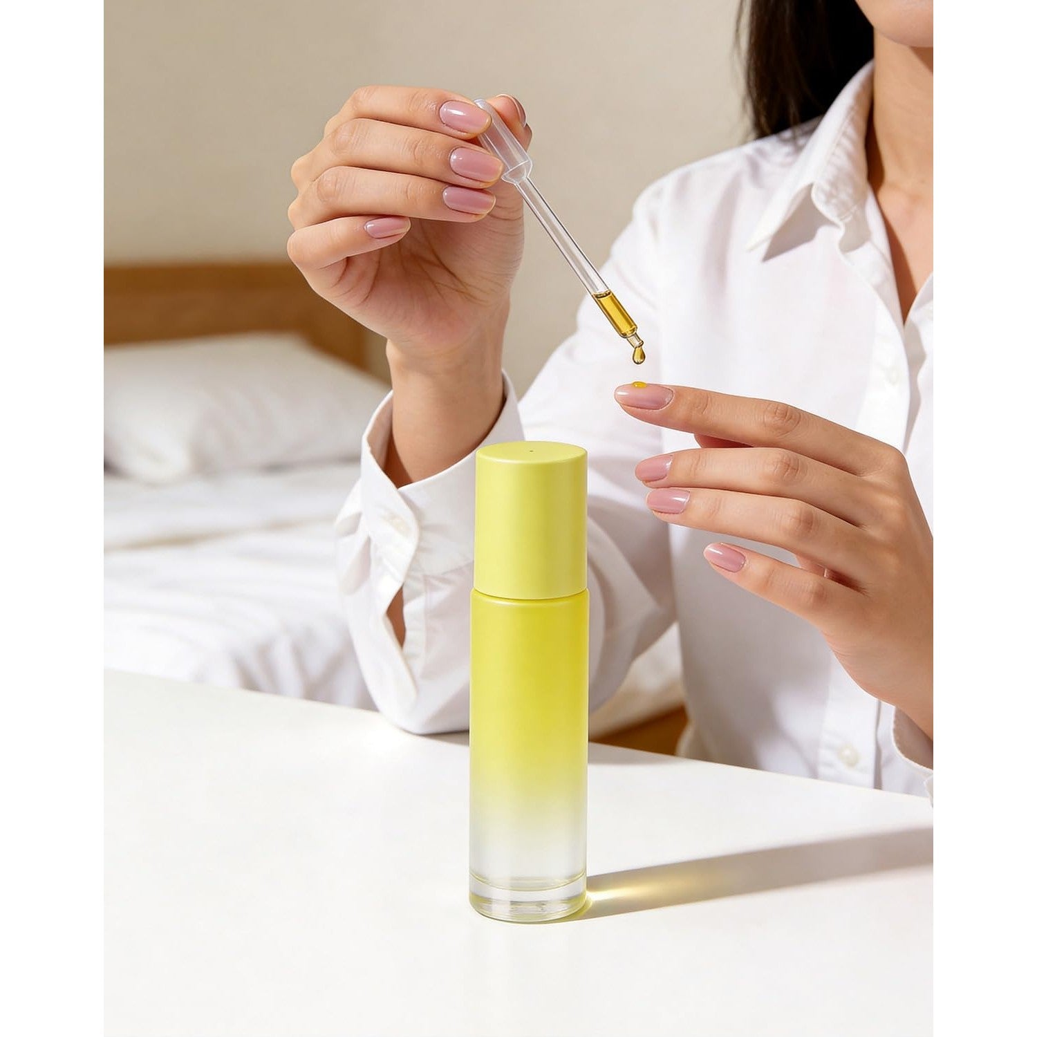 A person using a roller bottle for essential oils, perfect for aromatherapy. Available in packs of 12. Order online today!