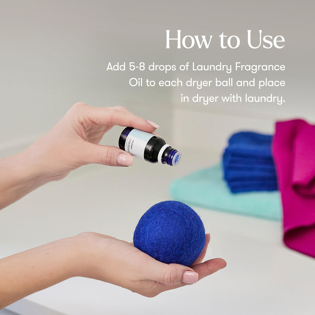 Capri Blue Volcano Laundry Fragrance Oil being added to a dryer ball. 100% Authentic, available at Curat Cart in India.