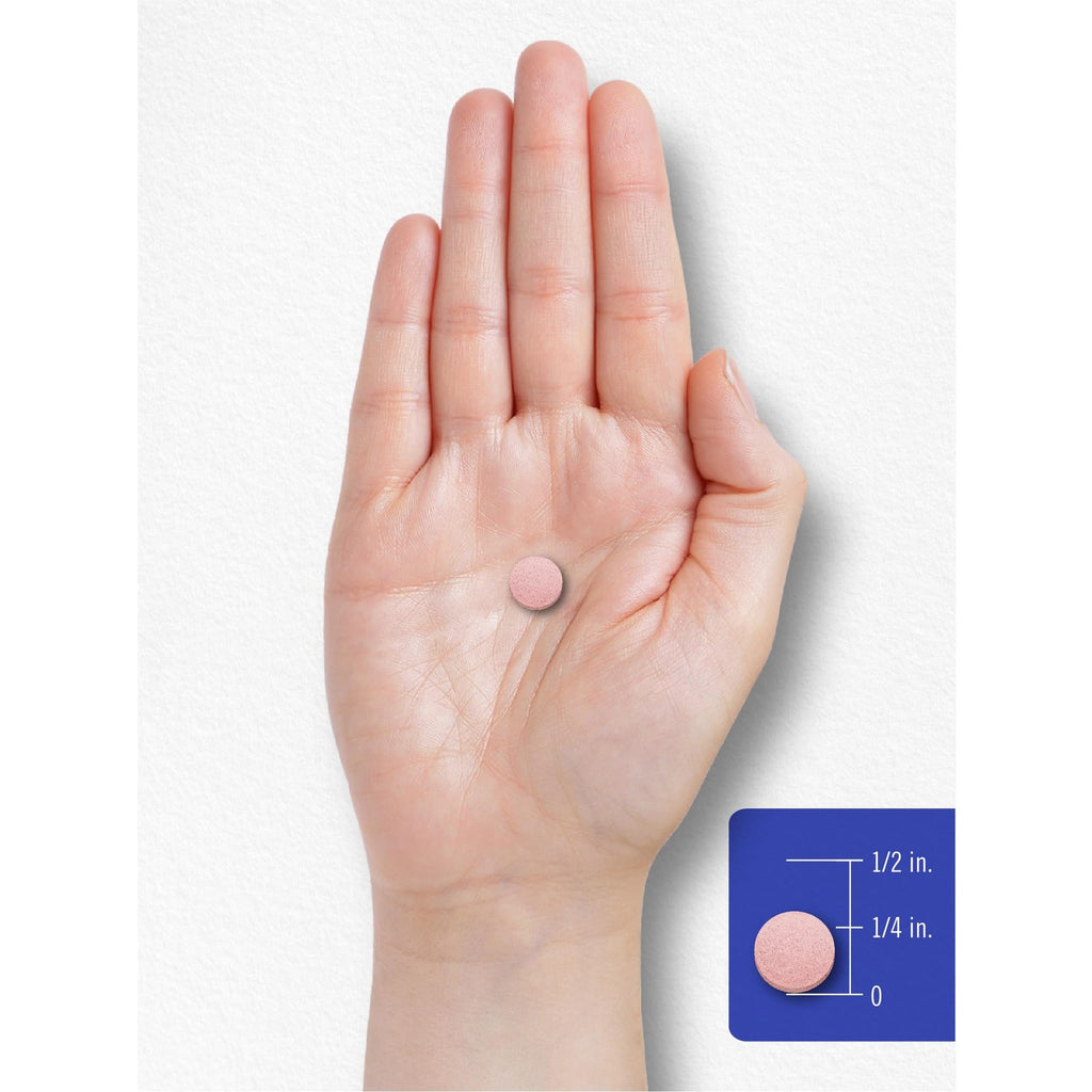Carlyle Vitamin B-12 tablet showcased on a hand, illustrating its small size. 100% Authentic and available at Curat Cart in India.