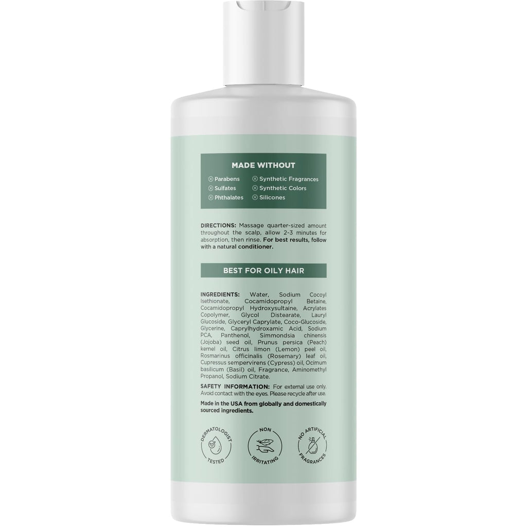 Clear bottle of clarifying shampoo made without sulfates or parabens. Ideal for oily hair, with key ingredients listed.