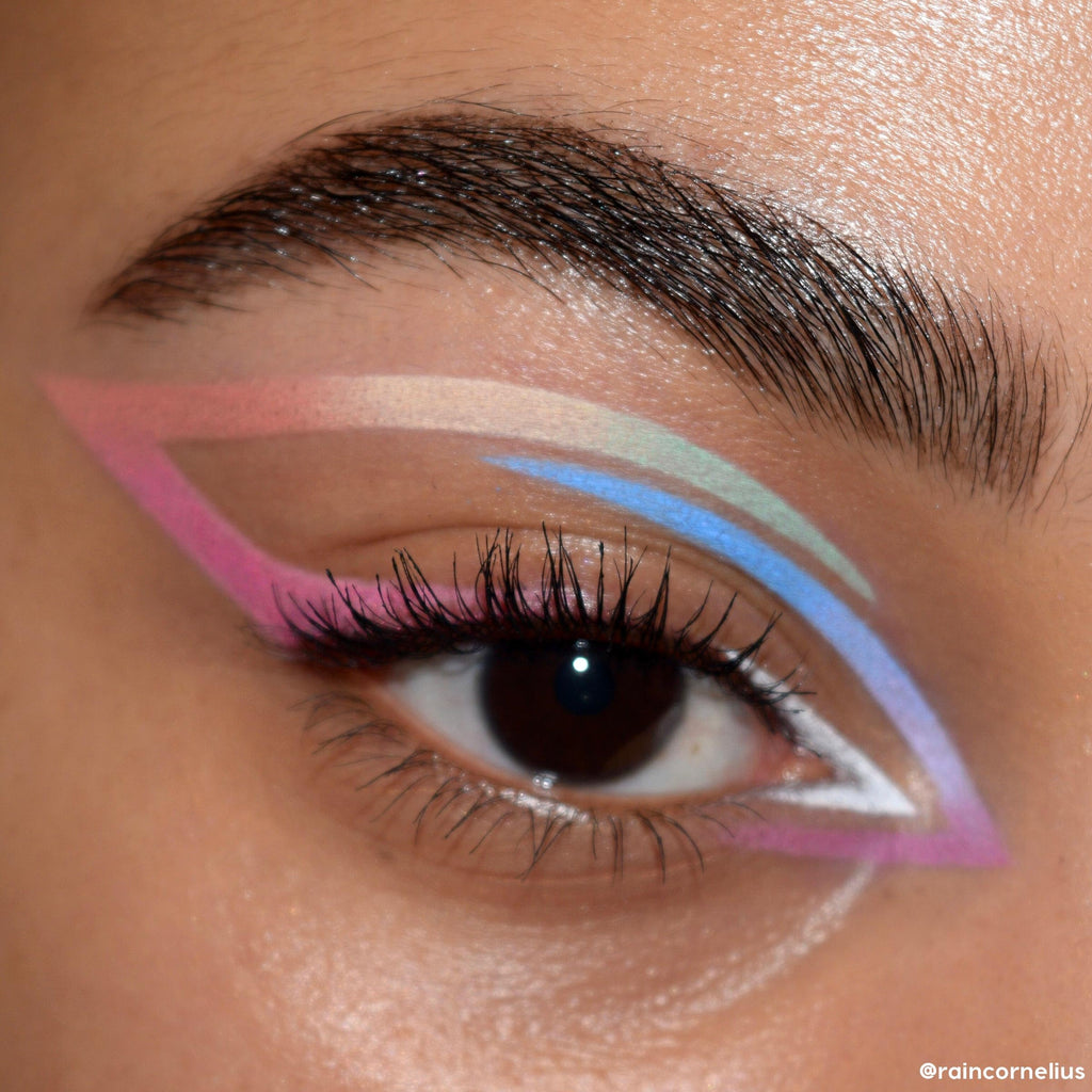 Eye adorned with striking, bold colors showcasing the ColourPop Stone Cold Fox Eyeshadow Palette. Verified by CuratCart for authenticity.
