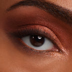 Close-up of an eye featuring a warm copper eyeshadow look from the ColourPop Stone Cold Fox Palette. Premium quality imported shades.