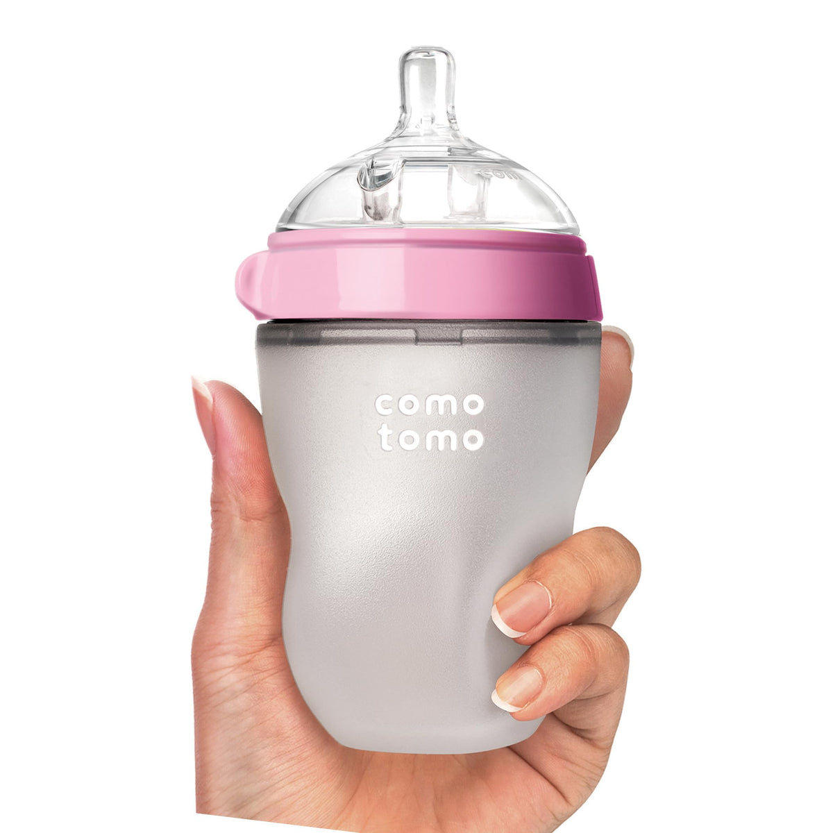 Comotomo baby bottle in hand, soft silicone design. Available in India, order online for your baby's needs.