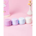 Four pastel-colored travel containers for toiletries, perfect for authentic travel convenience and organization.