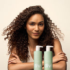 Model showcasing Divi Volumizing Shampoo and Conditioner. Curly hair care products verified by CuratCart for quality.