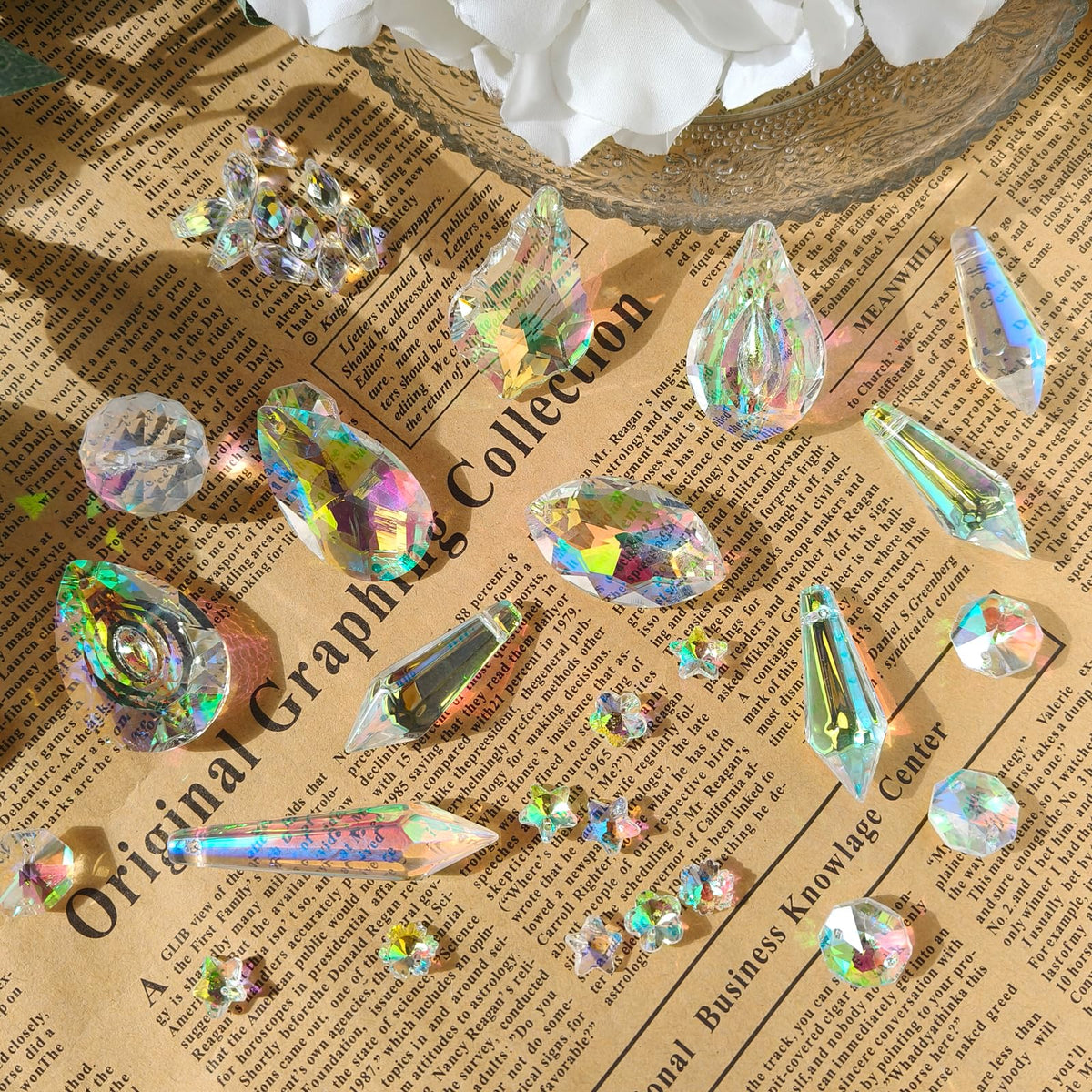 Vibrant suncatcher kit crystals displayed on textured paper, perfect for arts and crafts. Available at Curat Cart.