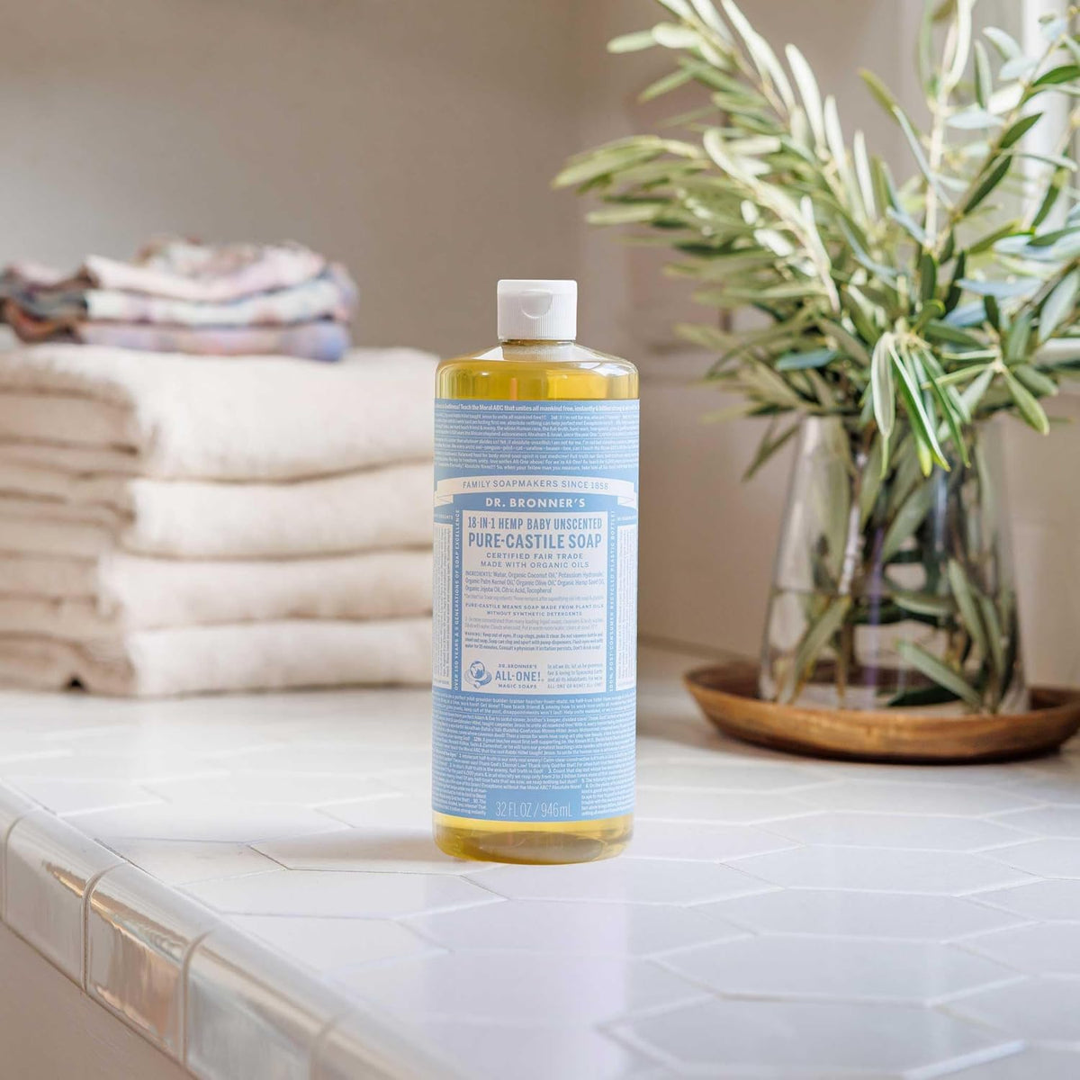 Discover Dr. Bronner's Pure-Castile Liquid Soap in original packaging, perfect for versatile cleaning and personal care.