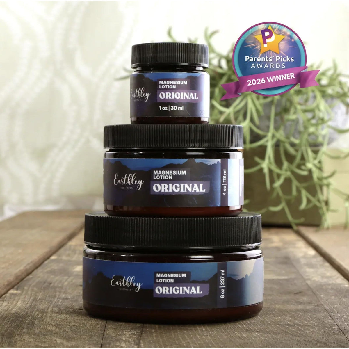Three jars of Earthley Magnesium Lotion in various sizes, showcasing the award-winning formula for wellness.